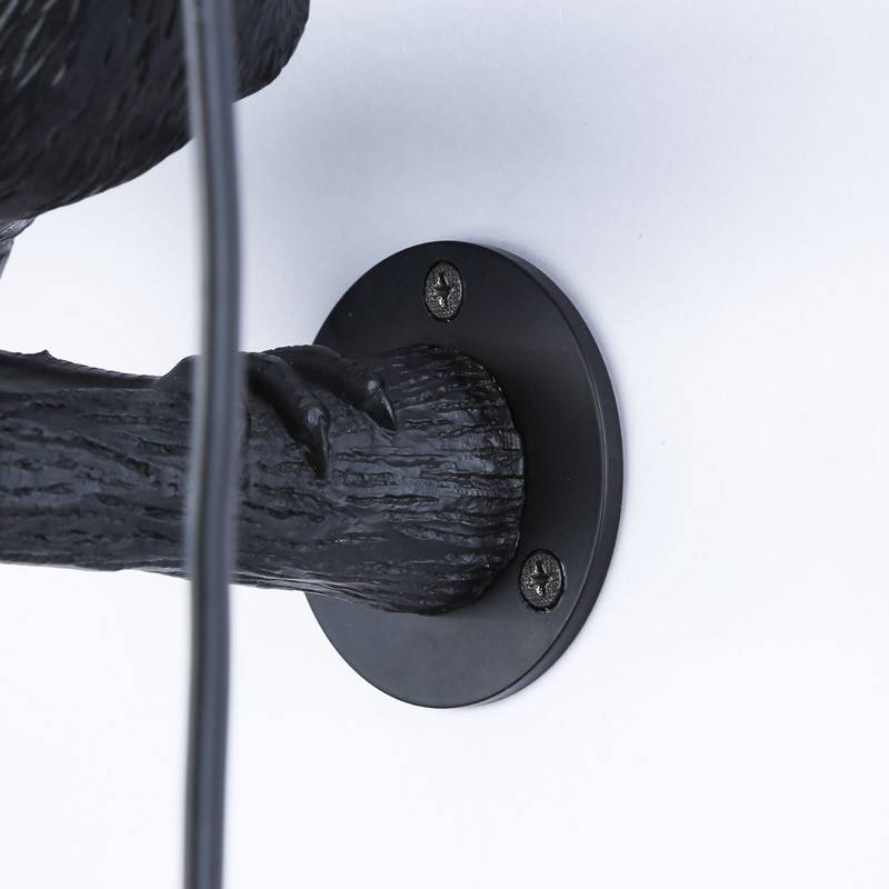 Raven wall lamp in resin "Corb".